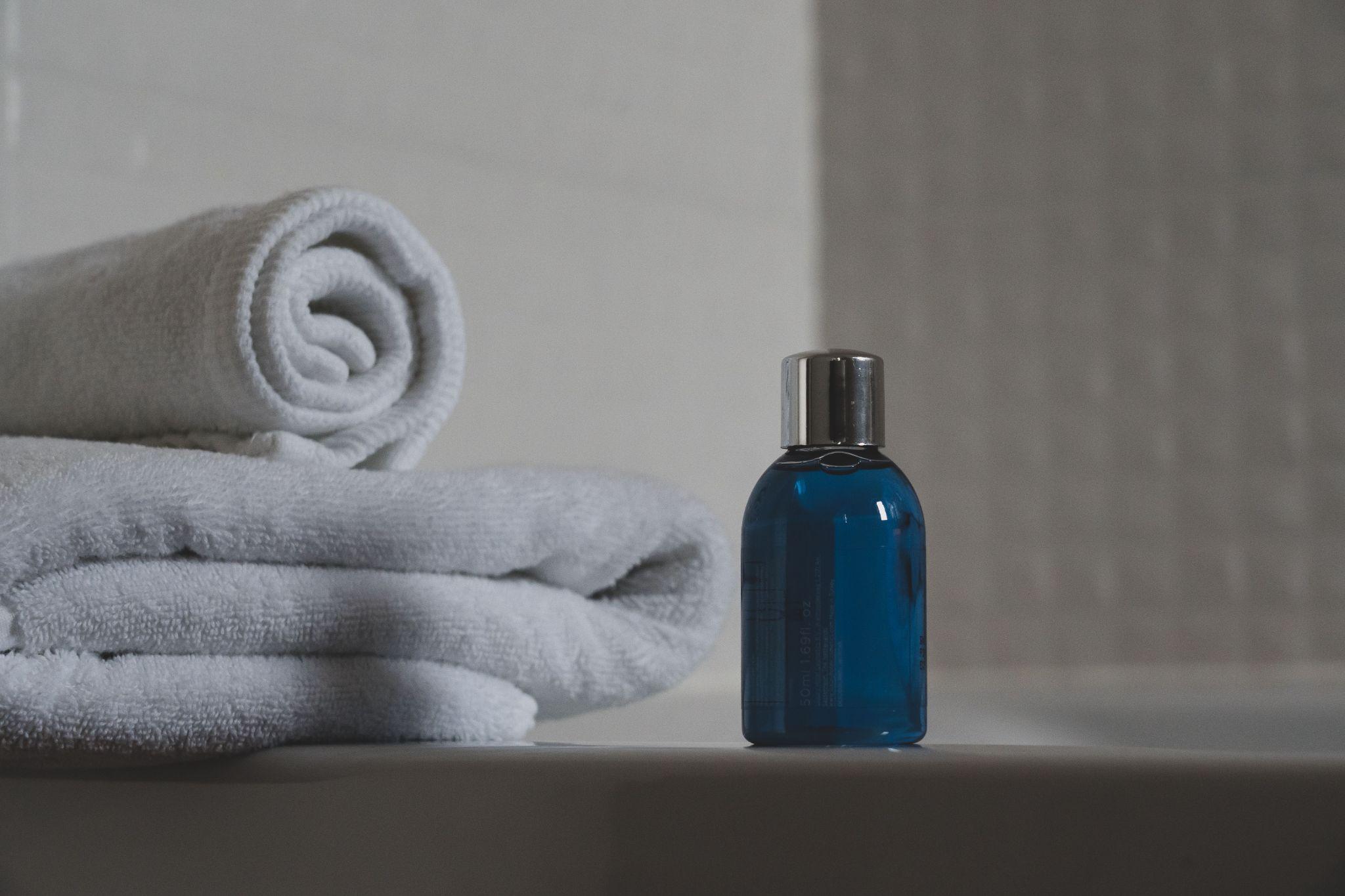Massage oil and towels arranged for treatment